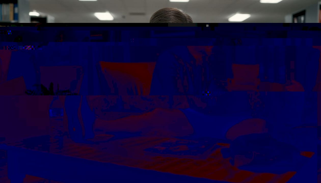 Middle-aged man stretching after exercise at home