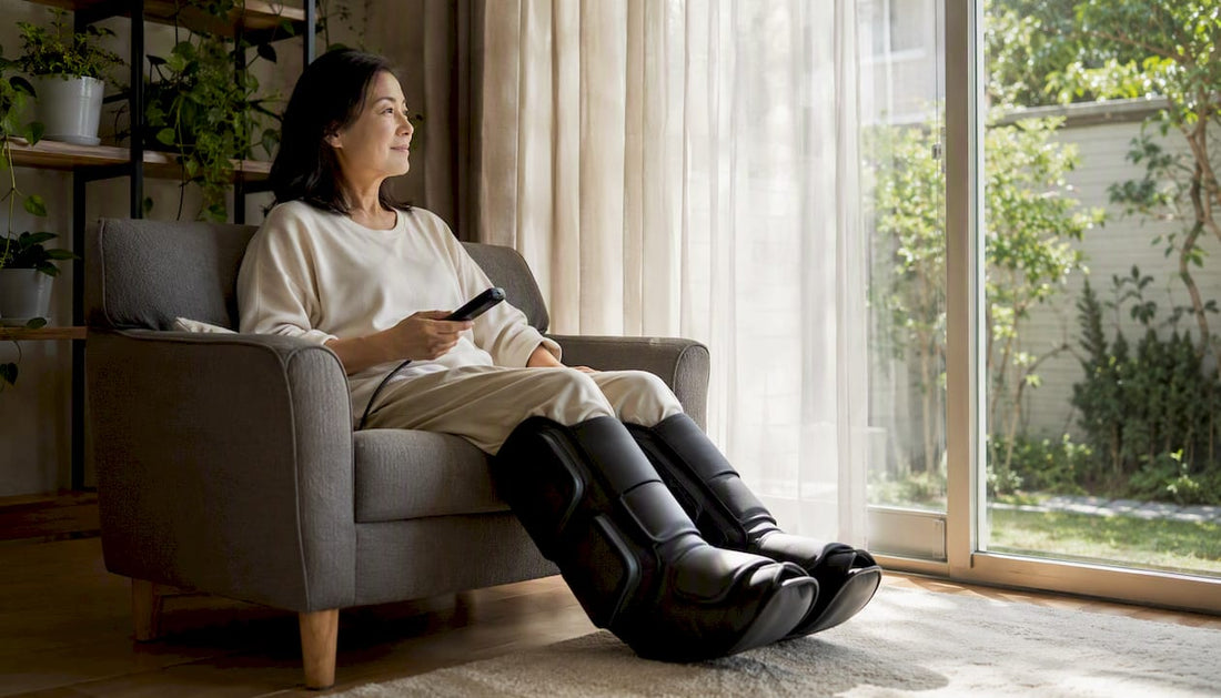 Woman using leg massager at home