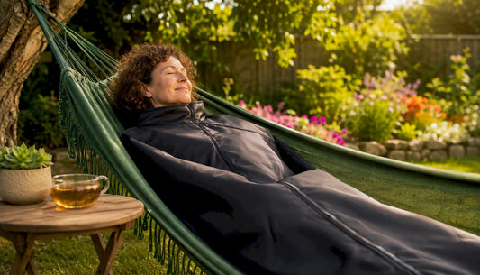 Woman relaxing with sauna blanket at home