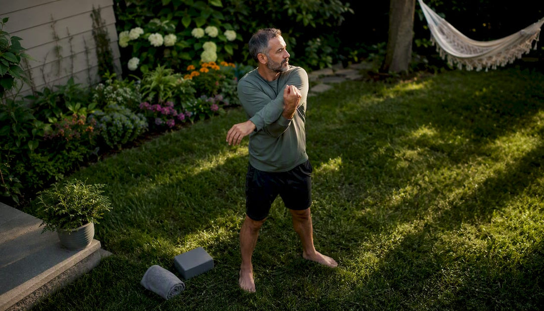 Middle-aged person stretching outdoors