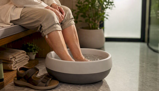 Feet soaking in foot bath at home