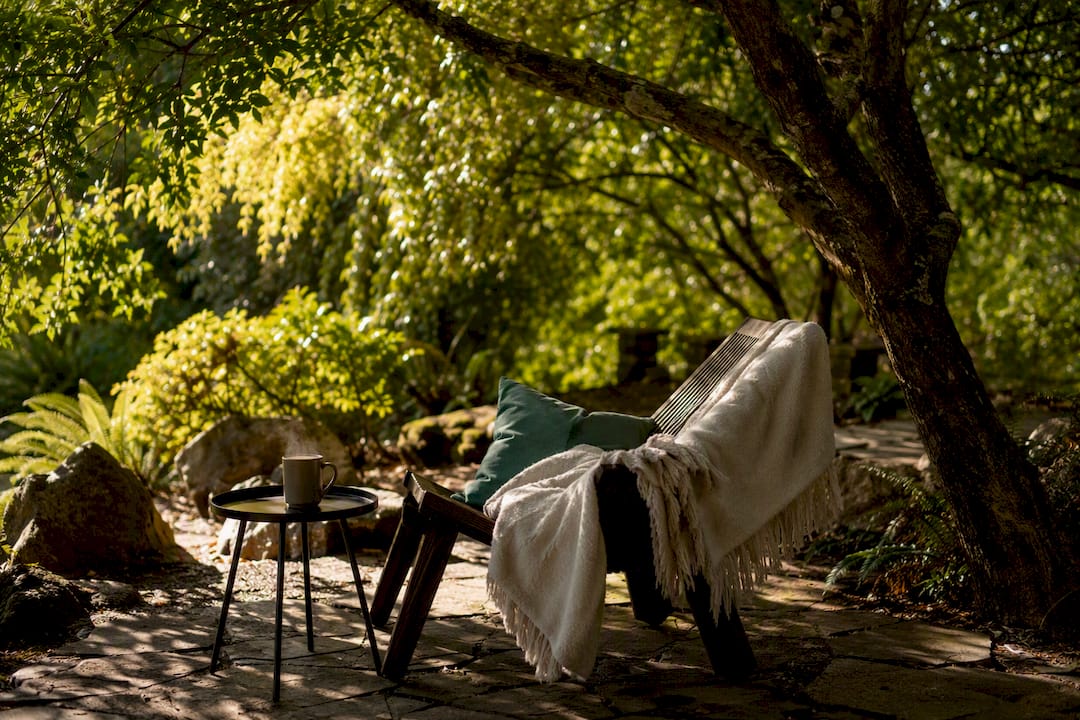Cozy home mindfulness corner with cushion and tea