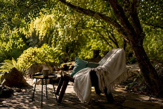 Cozy home mindfulness corner with cushion and tea