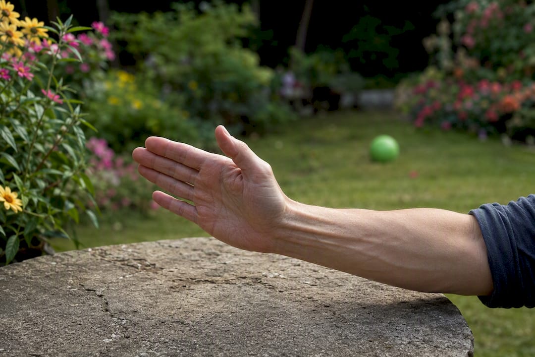 Hand performing tendon glide therapy exercises