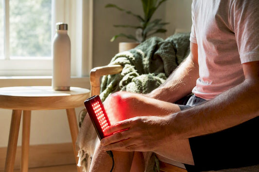 Red light therapy panel on knee