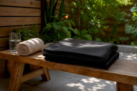 Sauna blanket and hydration setup in bedroom