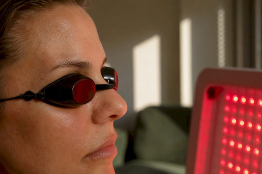 Person wearing eye protection during red light therapy