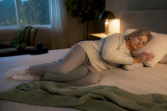 Woman settling into side sleeping position