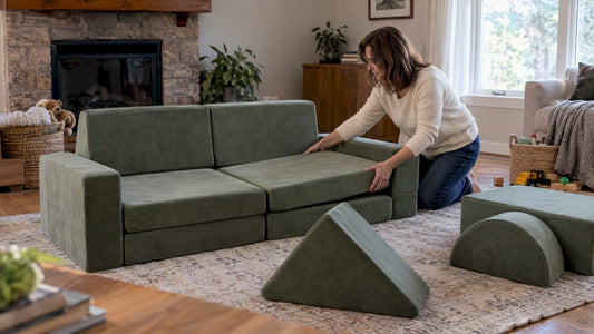 Woman arranging modular play couch pieces