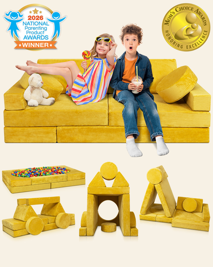 A children's modular yellow play couch with toy blocks and a ball pit, shown with two children sitting on the couch. 