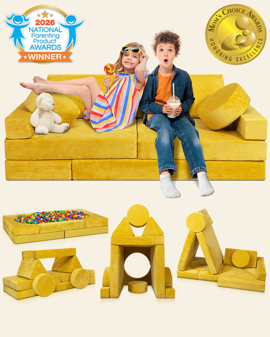 A children's modular yellow play couch with toy blocks and a ball pit, shown with two children sitting on the couch. 
